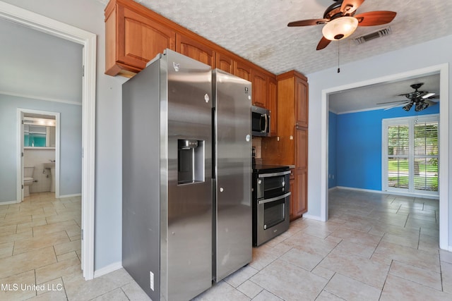 120 Pitcher Pt, Long Beach, MS 39560 - kitchen featuring stainless steel appliances, ceiling fan, and baseboards