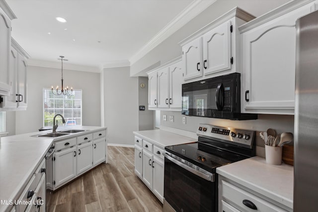 kitchen featuring crown molding, stainless steel appliances, white cabinetry, and a sink
