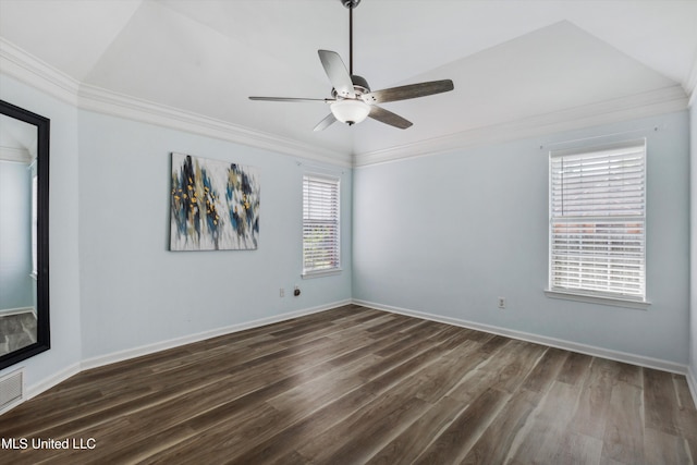 empty room with crown molding, dark wood-style flooring, a ceiling fan, and baseboards