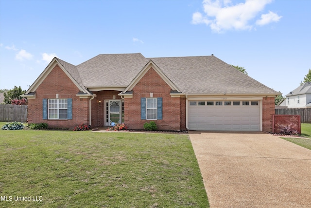 view of front facade featuring fence, a front yard, brick siding, an attached garage, and driveway
