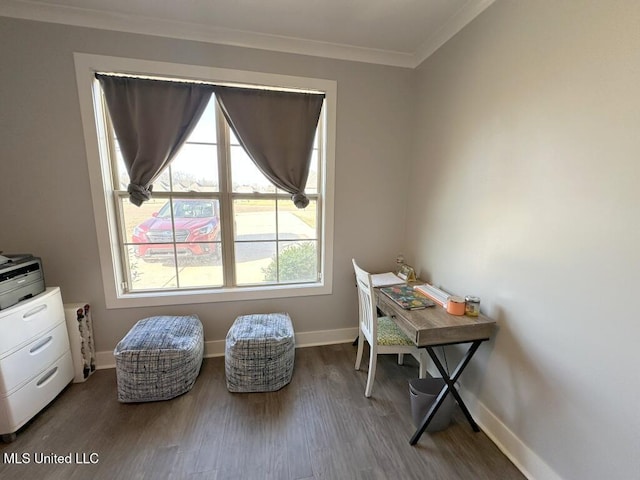 office space featuring crown molding, wood finished floors, and baseboards