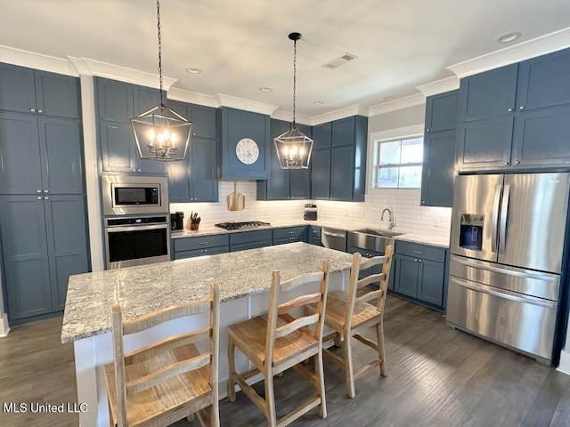 kitchen with visible vents, backsplash, stainless steel appliances, and crown molding