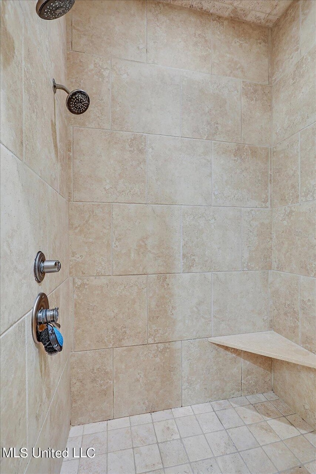 bathroom with a tile shower