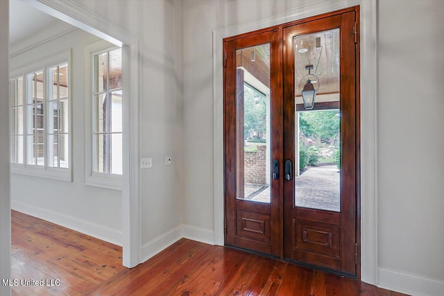 entryway with french doors and dark hardwood / wood-style flooring