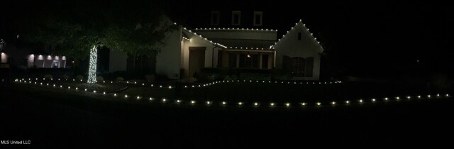 view of back house at night