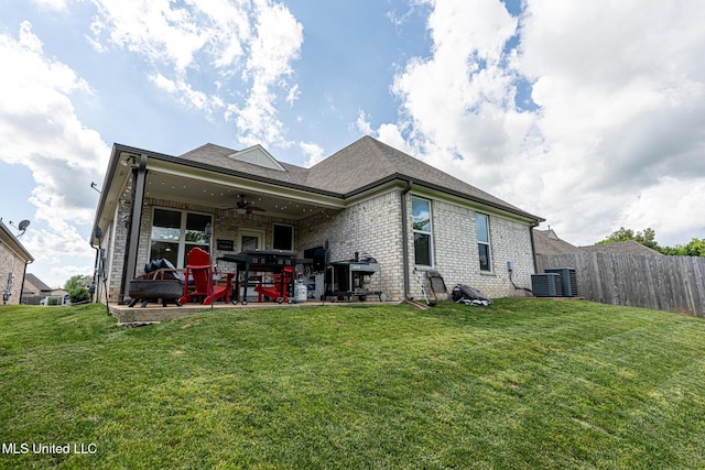 6750 Whooper Swan Dr, Olive Branch, MS 38654 - rear view of property featuring a ceiling fan, a patio area, brick siding, and central AC