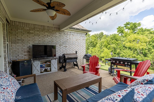 6750 Whooper Swan Dr, Olive Branch, MS 38654 - view of patio featuring area for grilling, ceiling fan, and outdoor lounge area