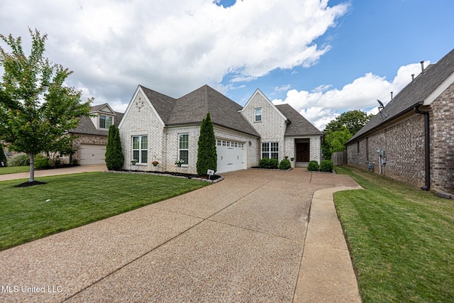 6750 Whooper Swan Dr, Olive Branch, MS 38654 - view of front of home featuring brick siding, concrete driveway, an attached garage, a front yard, and a shingled roof