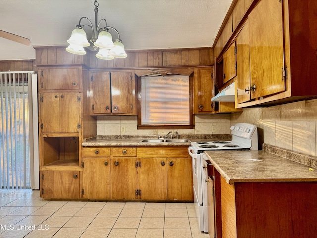 kitchen featuring sink, electric stove, decorative light fixtures, an inviting chandelier, and light tile patterned flooring