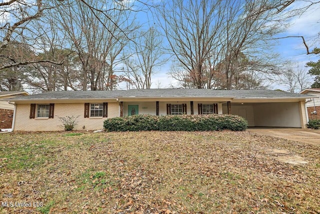 single story home featuring a front lawn and a carport