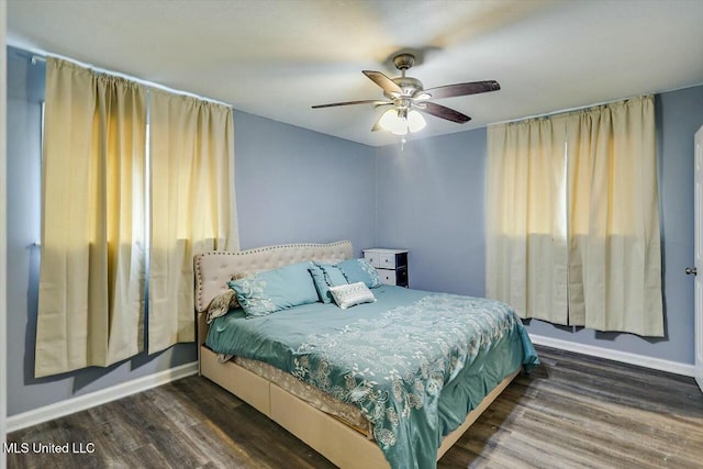 bedroom featuring dark wood-type flooring and ceiling fan