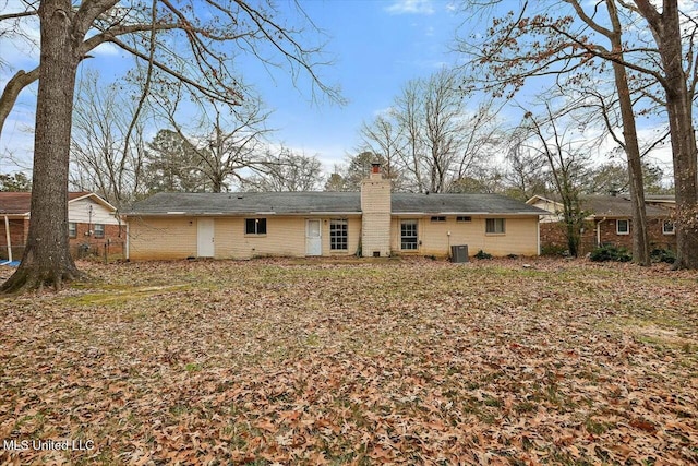 back of property with central AC unit