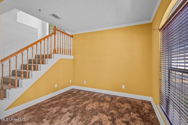 stairs featuring a healthy amount of sunlight, baseboards, and ornamental molding