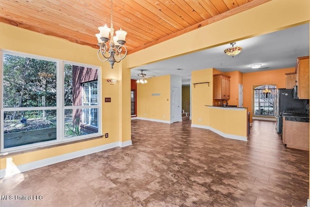 interior space with plenty of natural light, wooden ceiling, and baseboards