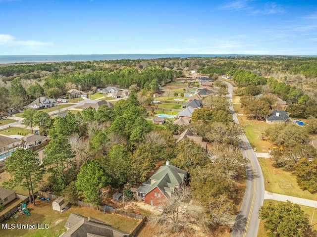 bird's eye view featuring a view of trees and a residential view