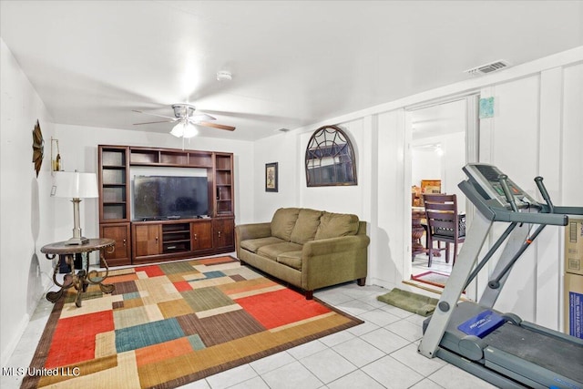 tiled living room with ceiling fan