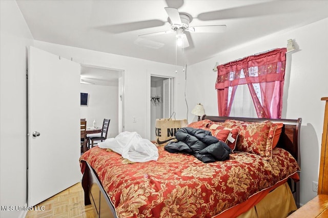 bedroom featuring light parquet floors and ceiling fan