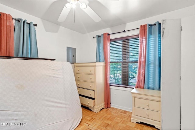 bedroom with light parquet floors and ceiling fan