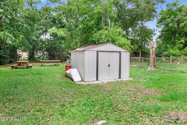 view of outdoor structure featuring a yard