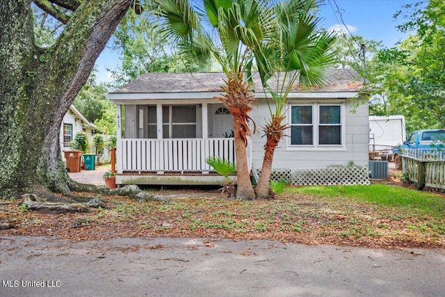 bungalow with a sunroom and central AC