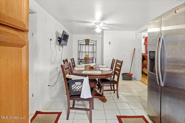 dining area with ceiling fan and light tile patterned floors