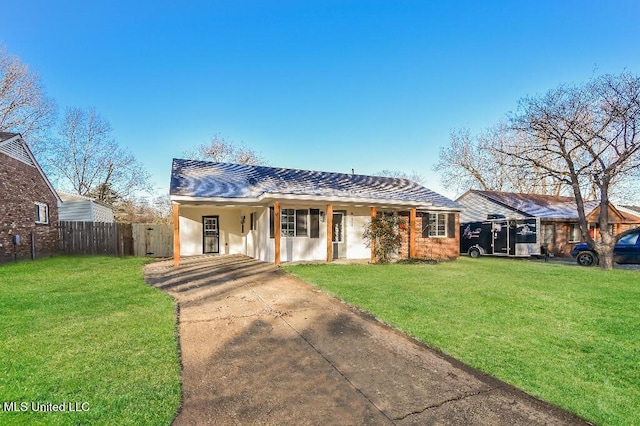 view of front of house with a front yard and a carport