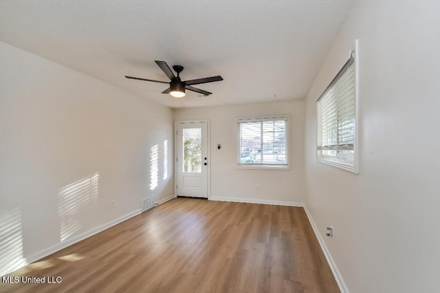 entrance foyer featuring ceiling fan and light wood-type flooring