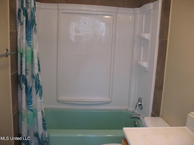 full bathroom with shower / bath combo, toilet, and vanity