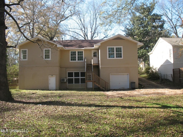 view of front facade with a front yard and a garage