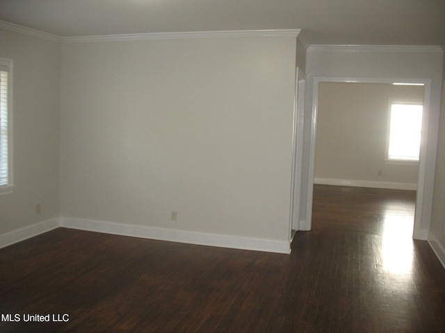 unfurnished room featuring crown molding and dark wood-type flooring