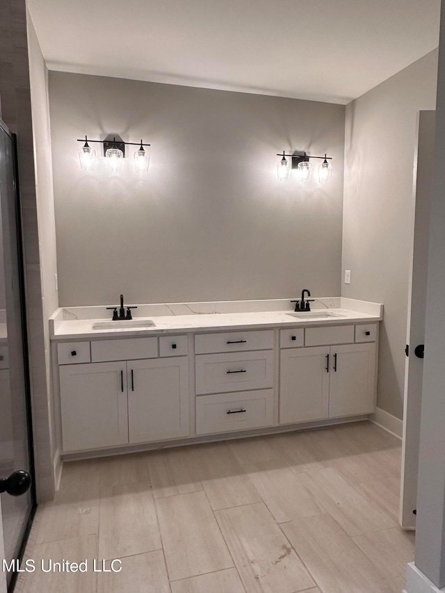 bathroom featuring vanity and hardwood / wood-style floors