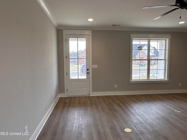 entryway with dark wood-type flooring, ceiling fan, and plenty of natural light