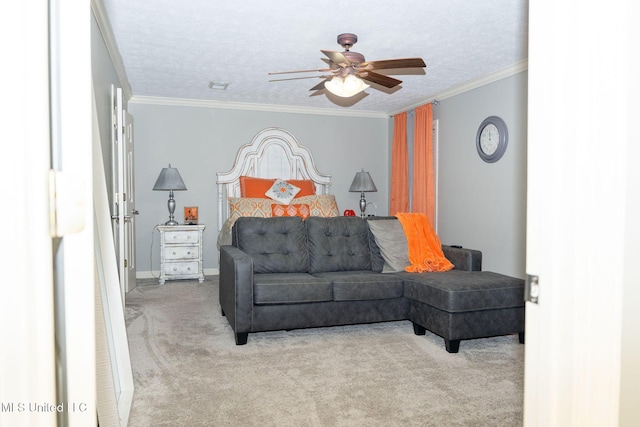 bedroom featuring carpet, ornamental molding, a ceiling fan, a textured ceiling, and baseboards