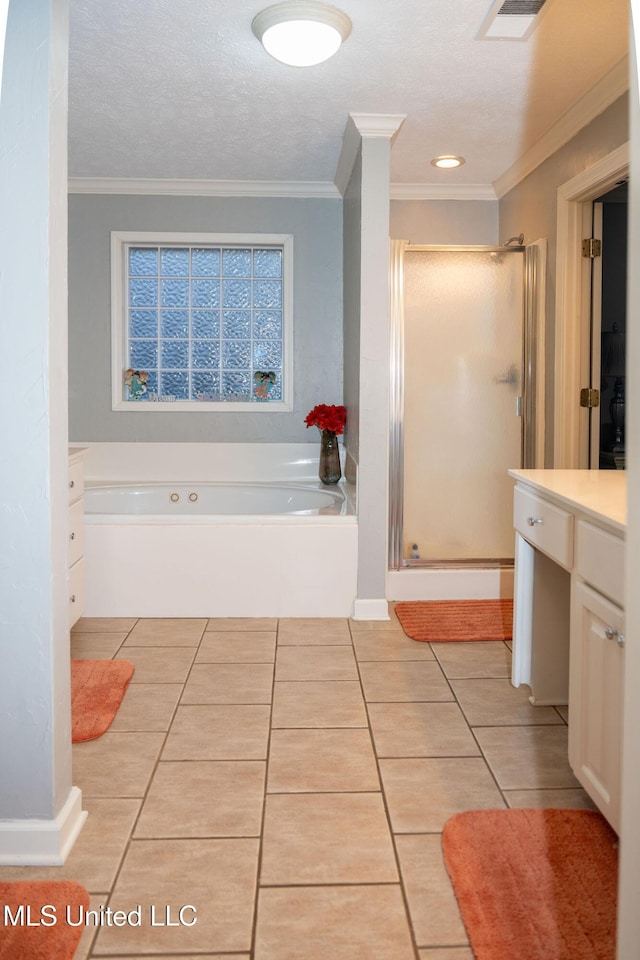 full bathroom featuring a stall shower, tile patterned flooring, visible vents, and a bath