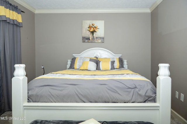 bedroom with a textured ceiling, ornamental molding, and baseboards