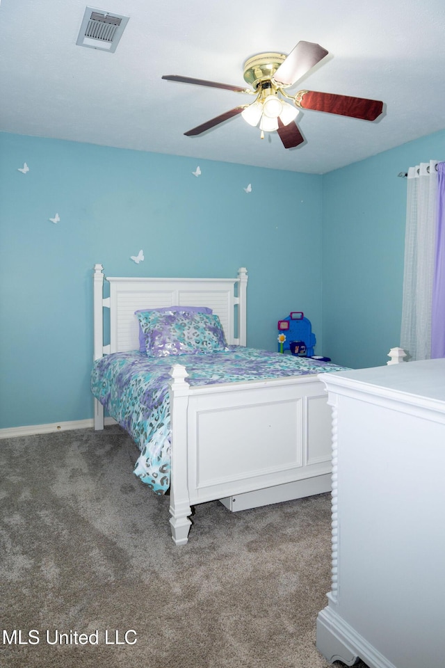 carpeted bedroom with ceiling fan and visible vents