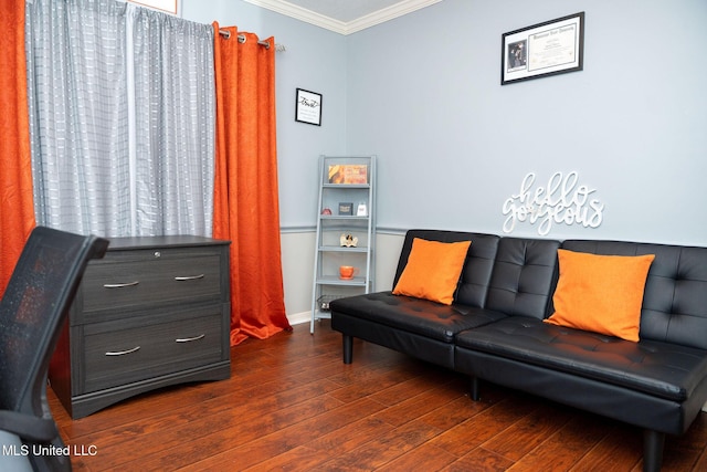 living area with dark wood-style floors, ornamental molding, and baseboards