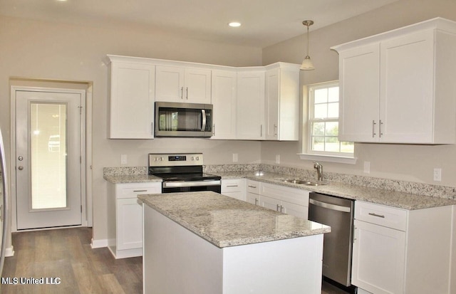 kitchen with a sink, white cabinetry, and appliances with stainless steel finishes