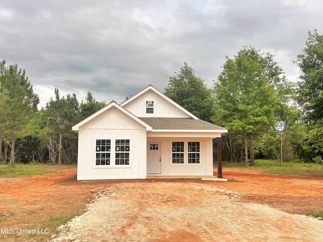 view of front of home with roof with shingles