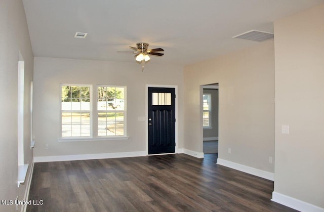 entryway featuring dark wood-style flooring, baseboards, a ceiling fan, and visible vents