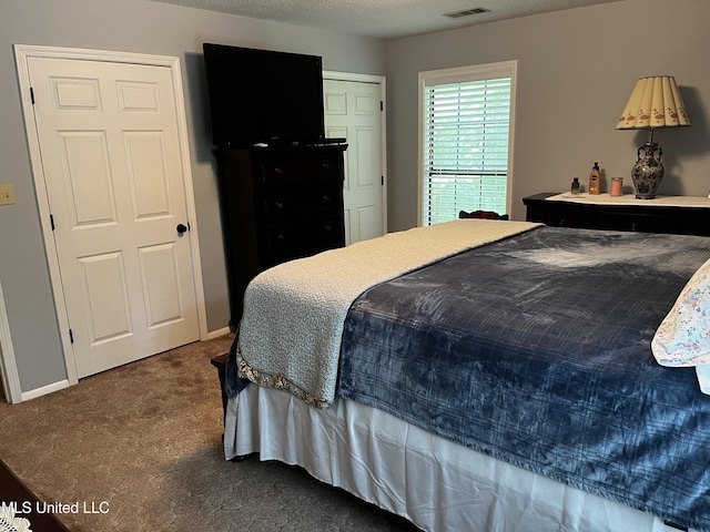 11423 High Rd, Hernando, MS 38632 - carpeted bedroom with a textured ceiling
