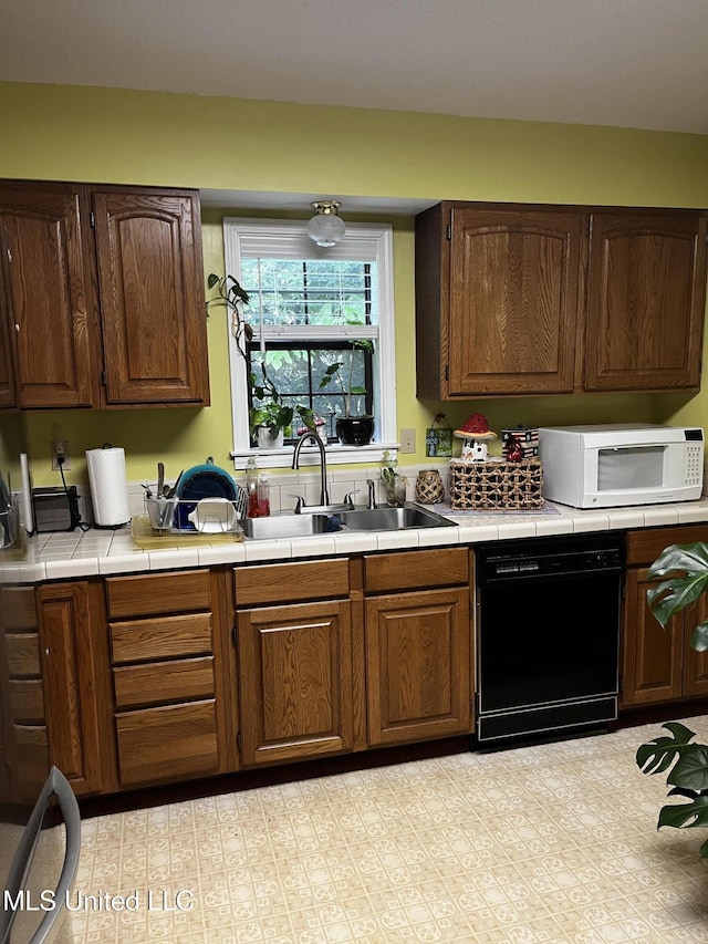 11423 High Rd, Hernando, MS 38632 - kitchen with dishwasher, white microwave, and tile counters