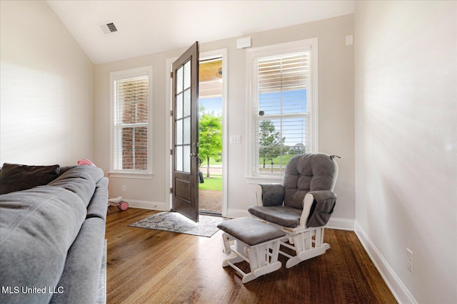 4943 W Margarette Cir, Olive Branch, MS 38654 - living area featuring wood finished floors, vaulted ceiling, and baseboards