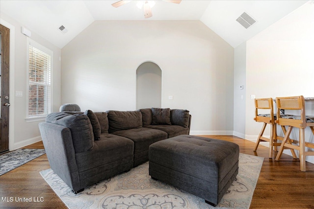 4943 W Margarette Cir, Olive Branch, MS 38654 - living room featuring arched walkways, vaulted ceiling, ceiling fan, light wood-style floors, and baseboards