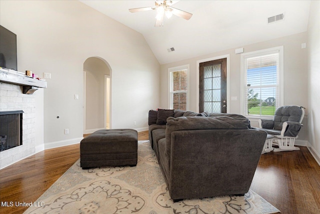 4943 W Margarette Cir, Olive Branch, MS 38654 - living room with arched walkways, a ceiling fan, wood finished floors, lofted ceiling, and baseboards