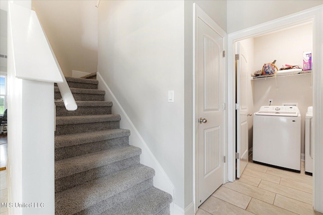 4943 W Margarette Cir, Olive Branch, MS 38654 - stairs with washing machine and clothes dryer and baseboards