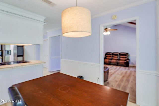5530 Spencer Dr, Jackson, MS 39212 - unfurnished dining area featuring wood finished floors, ornamental molding, and a ceiling fan