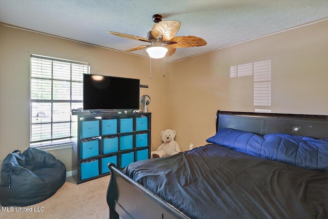5530 Spencer Dr, Jackson, MS 39212 - carpeted bedroom with a textured ceiling, ceiling fan, and multiple windows