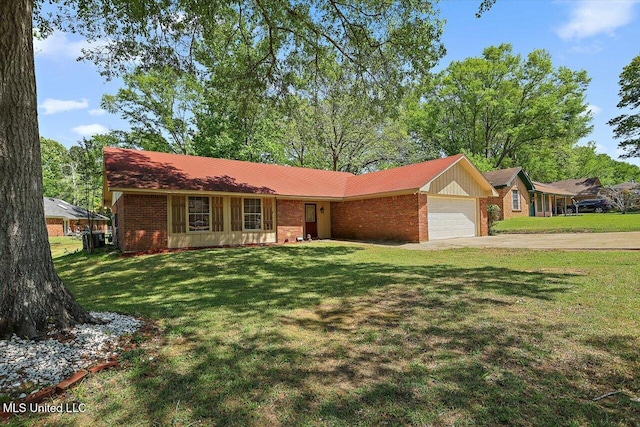 5530 Spencer Dr, Jackson, MS 39212 - ranch-style house featuring brick siding, driveway, a front lawn, and a garage
