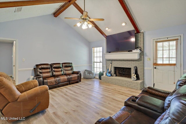 5530 Spencer Dr, Jackson, MS 39212 - living room featuring ceiling fan, wood finished floors, wainscoting, vaulted ceiling with beams, and a brick fireplace